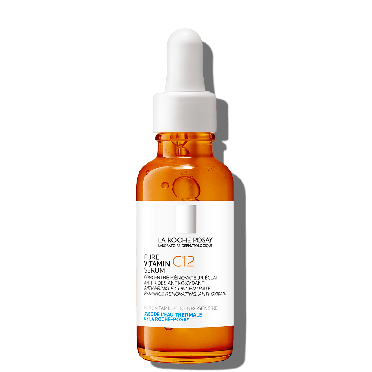 Vitamin C serum bottle, amber glass with white dropper cap and label